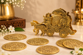 Krishna Rath metal coaster set with antique gold-tone finish — 1.png