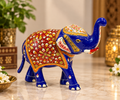Royal blue Meenakari painted metal elephant with raised trunk and red floral detailing
