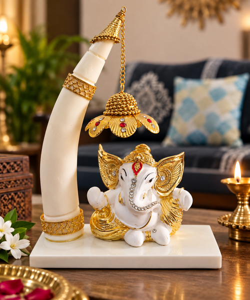 White and gold-tone Baal Ganesh décor with hanging lotus lamp on a rectangular base