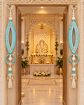 Handmade fish-eye latkans framing a mandir doorway