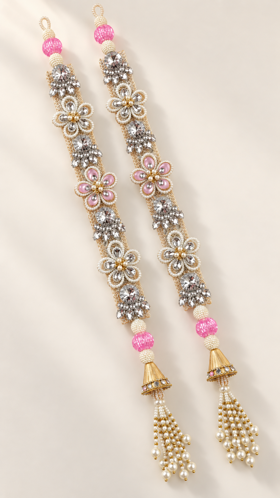 Handmade pink crystal latkan pair — left angle