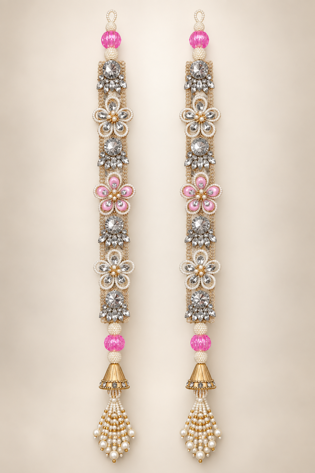 Handmade pink crystal latkan pair with pearl flowers and gold tassels — front view