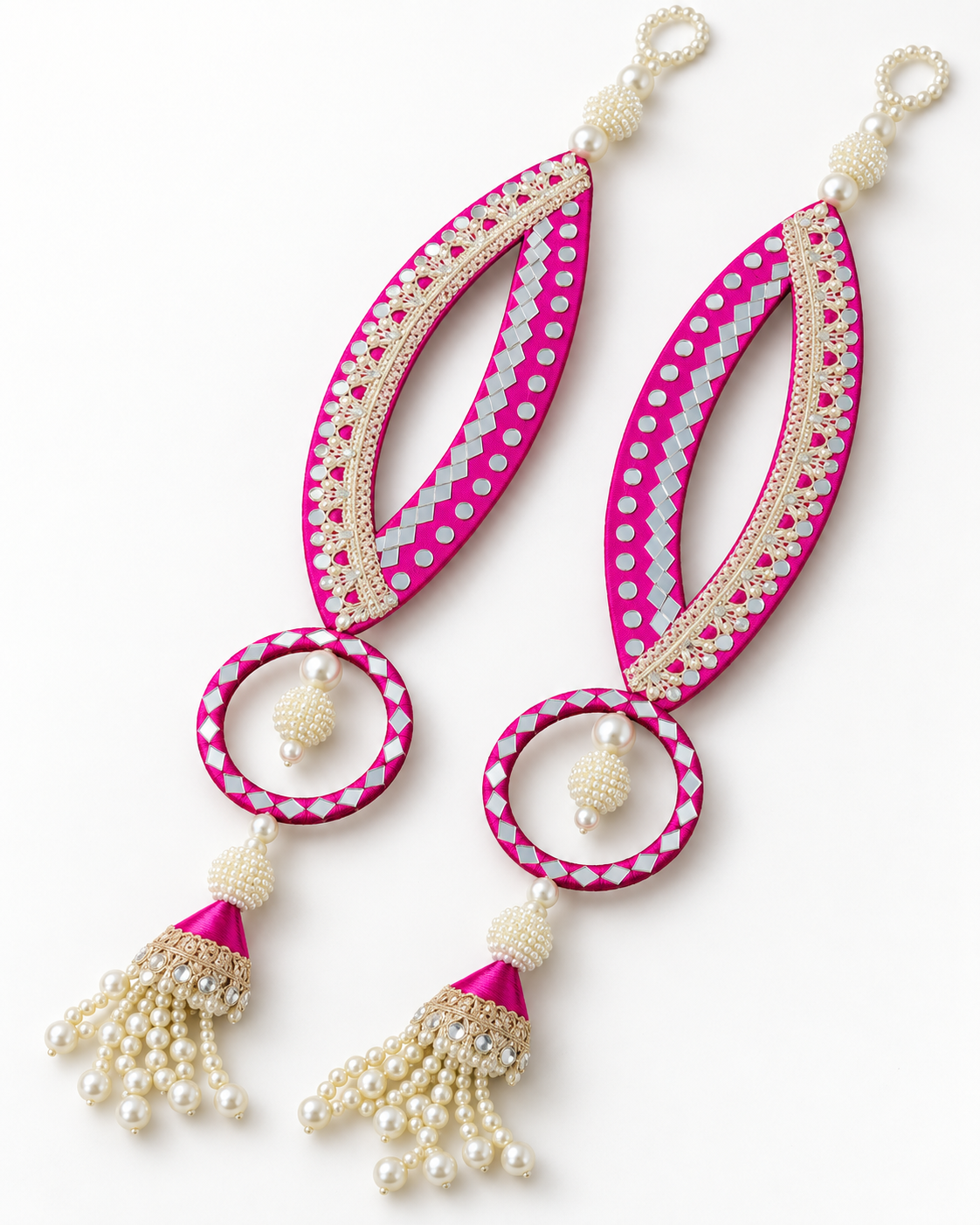 Handmade pink fish-eye latkans with reflective accents and pearl-like tassels