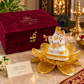 White and gold-tone Radha Krishna décor seated on an intricate gold-polish lotus