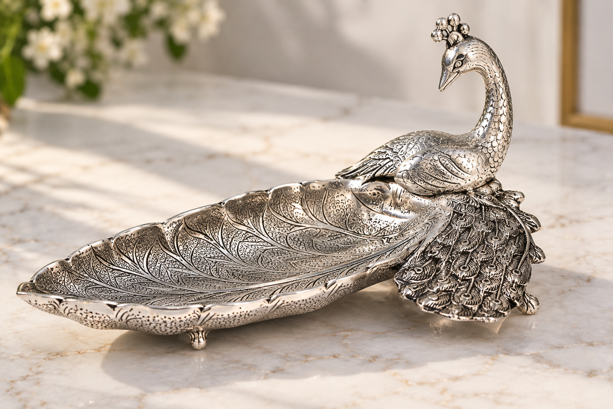 Antique silver-tone aluminium peacock plate — right side