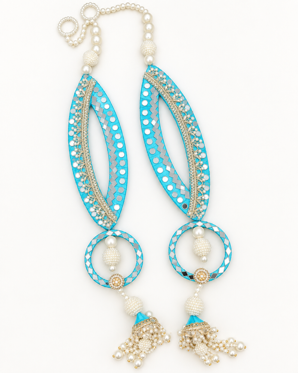 Handmade turquoise fish-eye latkans with reflective accents and pearl-like tassels